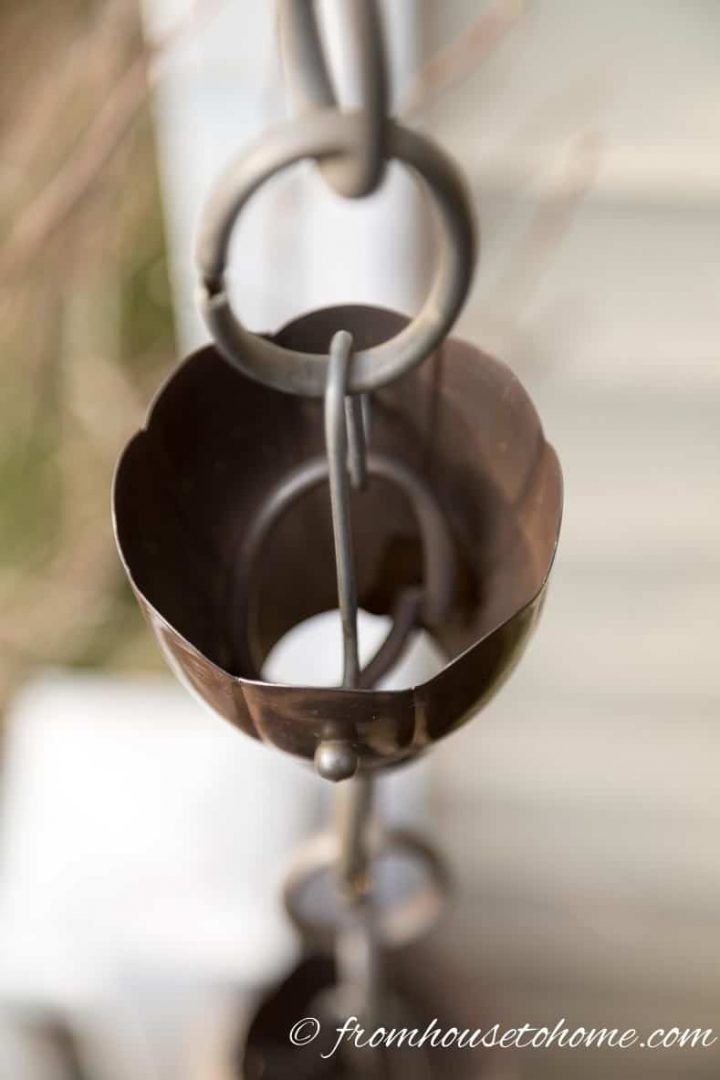 Rain chain cup with hole in the bottom