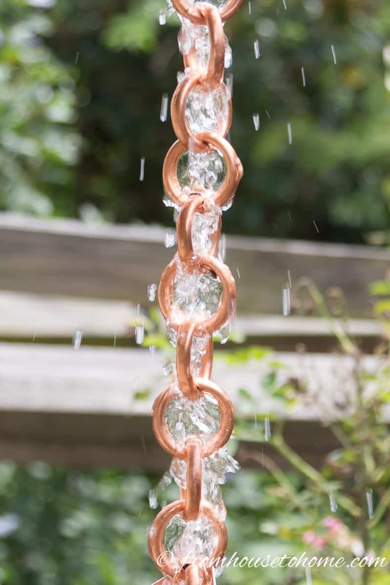 DIY copper rain chain rings with water running down them