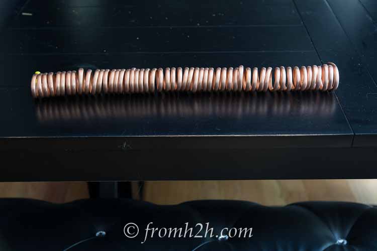 The coiled copper tubing after it has been removed from the broomstick