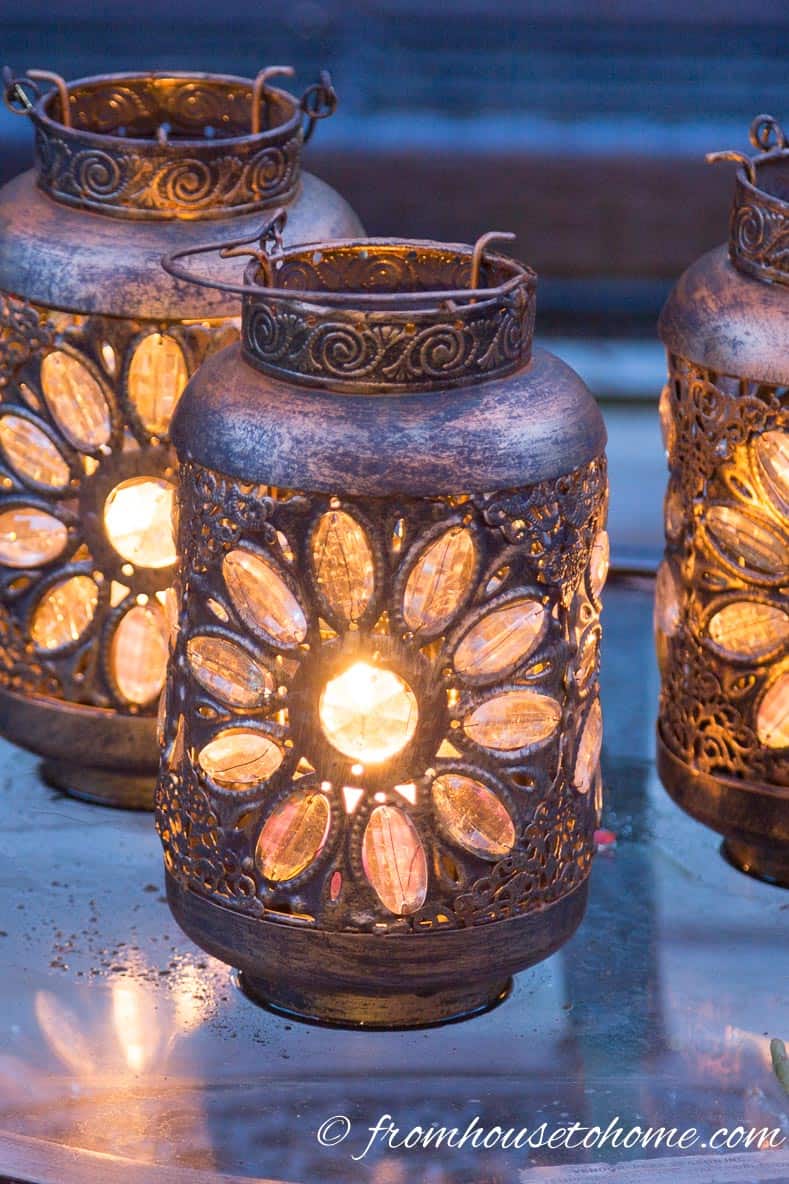 Lanterns are inexpensive outdoor decorative lighting | 8 Landscape Lighting Effects And How To Use Them | Whether you're looking for DIY landscape lighting ideas for your front yard, backyard or walkway, this list will help! It shows you lots of ways to use both low voltage and solar lights in your garden or patio.