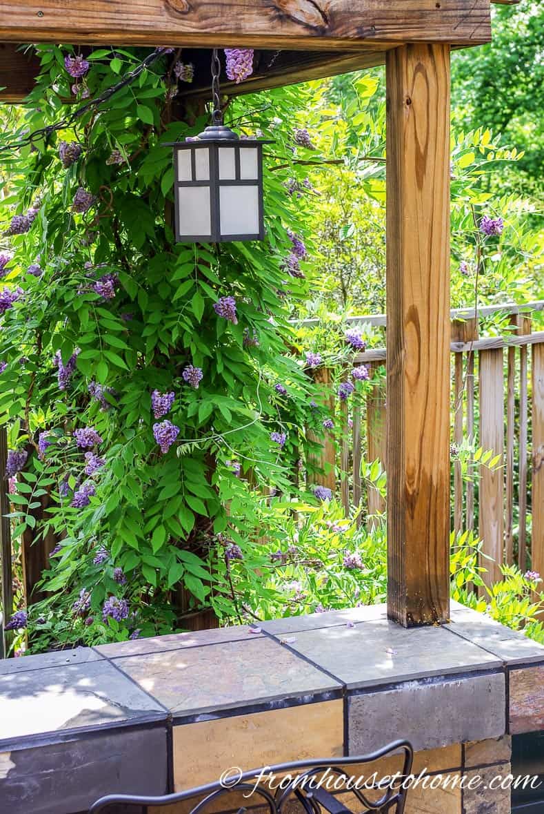An outdoor pendant light provides lots of light over the bar | 10 Beautiful Ways To Light Your Garden