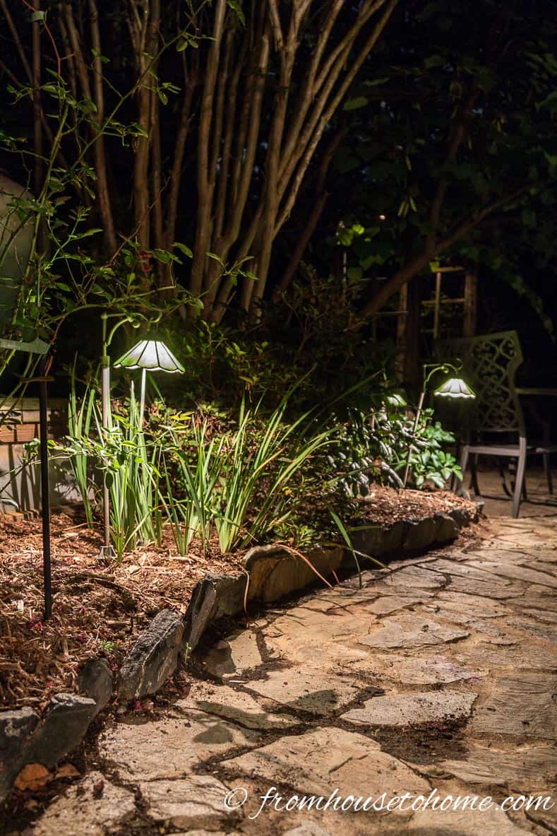 Low voltage landscape lighting creates a beautiful night time scene | 10 Beautiful Ways To Light Your Garden