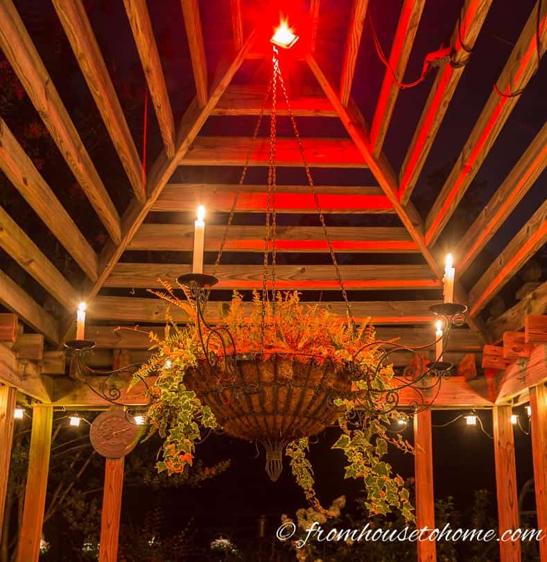 A flood light installed at the top of the gazebo provides general mood lighting | 10 Beautiful Ways To Light Your Garden