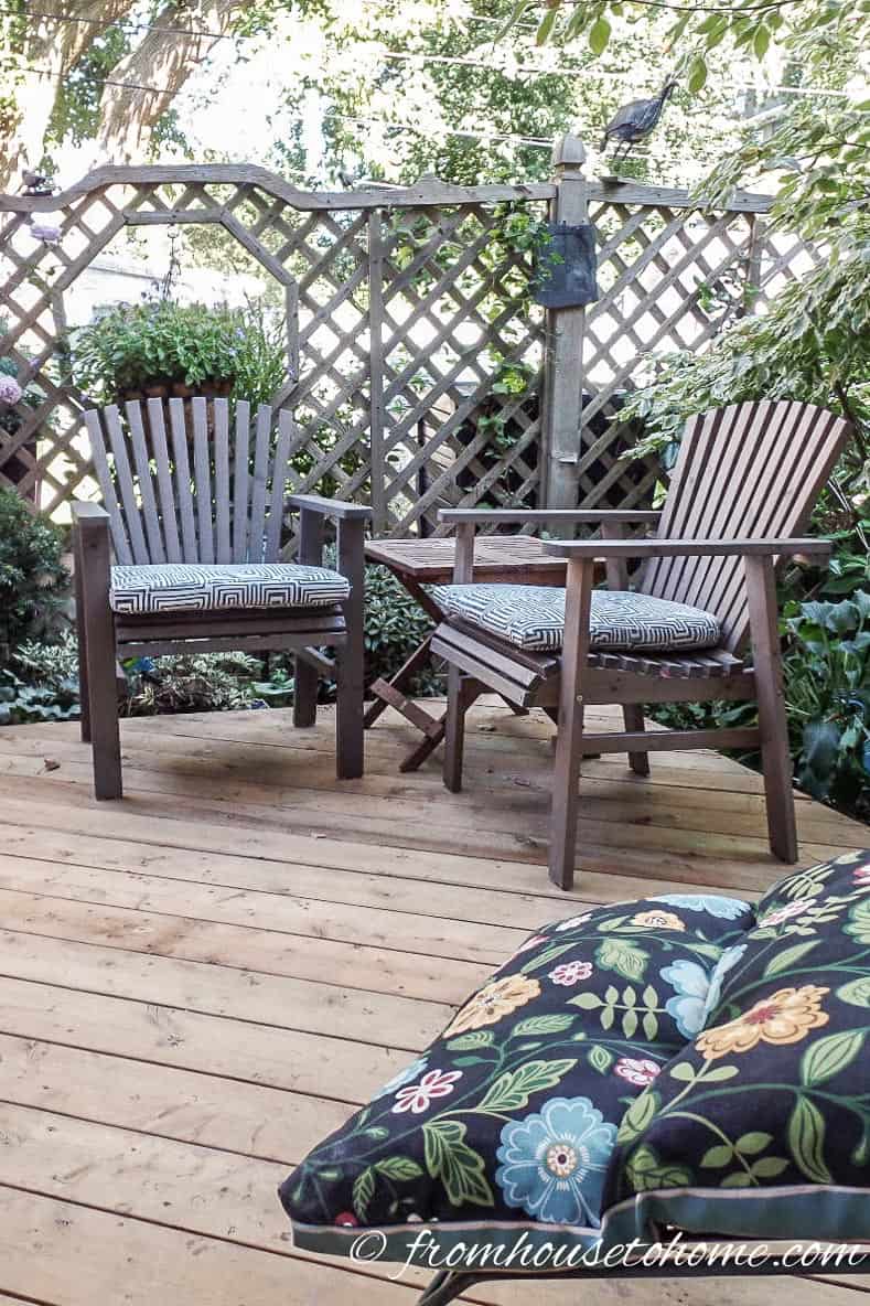 patio chairs with blue and white cushions on a deck