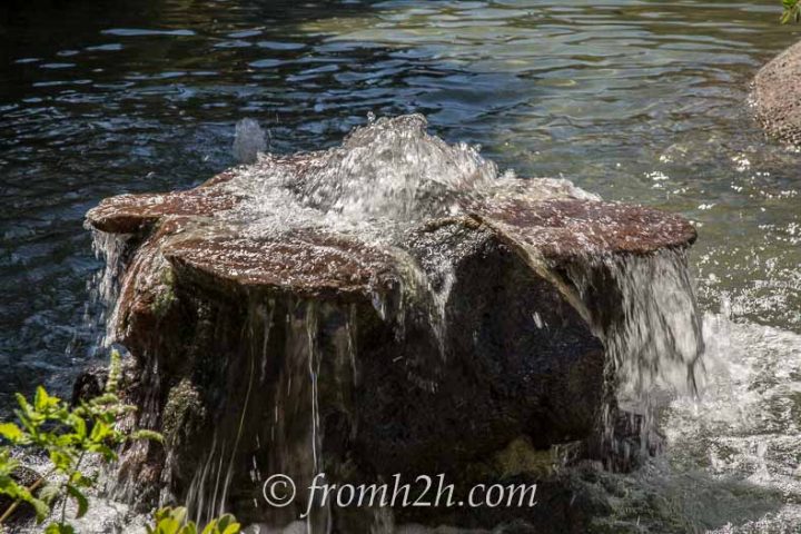 A bubbling water fountain made from a rock