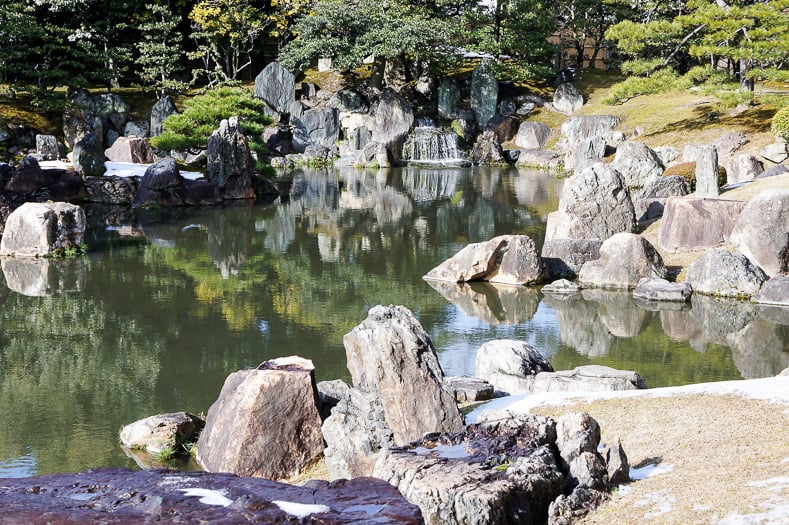 Japanese garden pond with large rocks