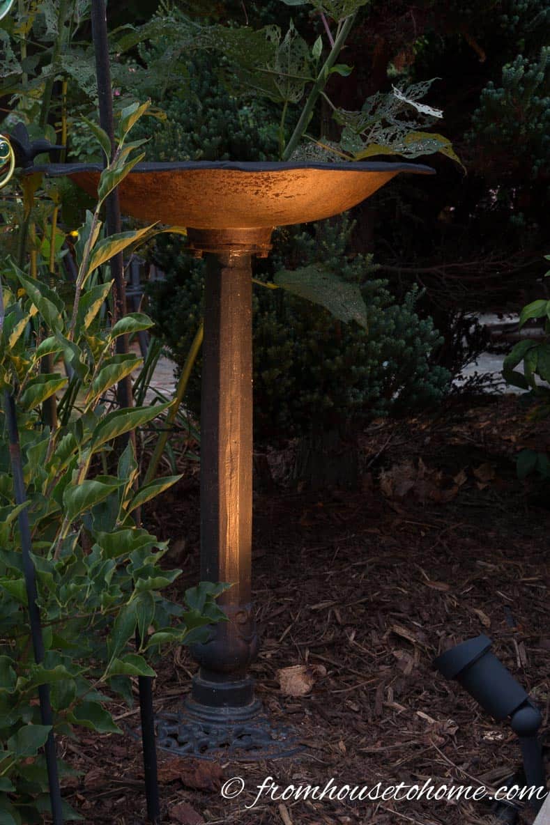 Highlight a birdbath or statue | 8 Dramatic Landscape Lighting Effects and How to Use Them | Whether you're looking for DIY landscape lighting ideas for your front yard, backyard or walkway, this list will help! It shows you lots of ways to use both low voltage and solar lights in your garden or patio.