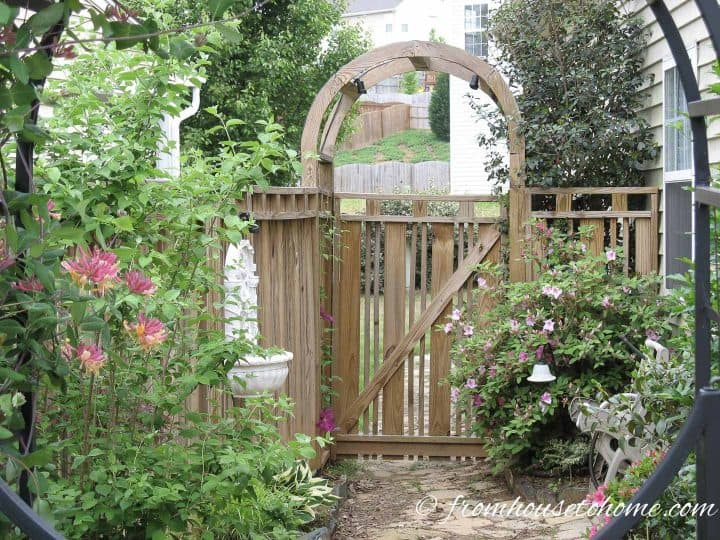 Wood garden gate with arch arbor