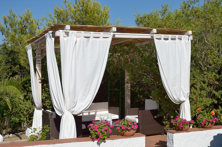 Curtains as a privacy screen on a pergola