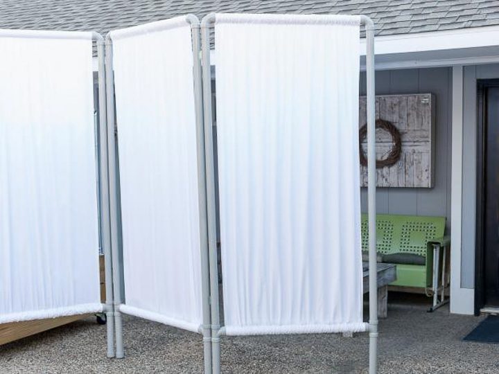 DIY fabric privacy wall made from PVC pipes via hgtv.com