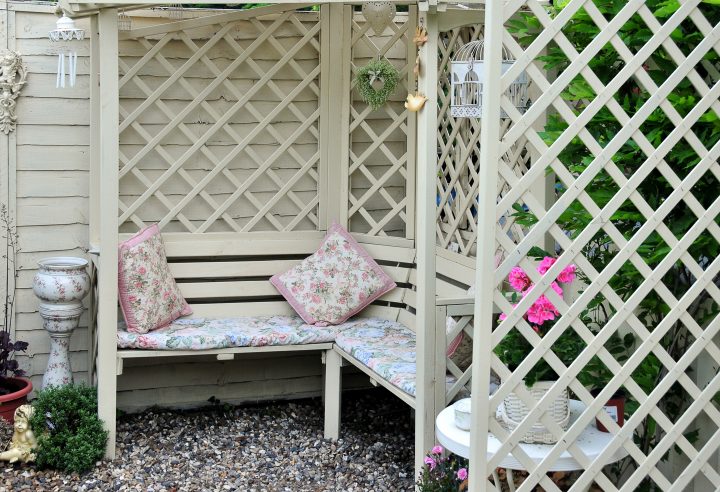 Patio bench surrounded by lattice privacy screen
