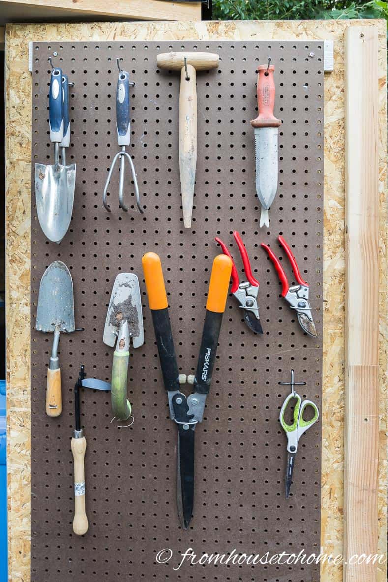 Use pegboard for storing garden hand tools
