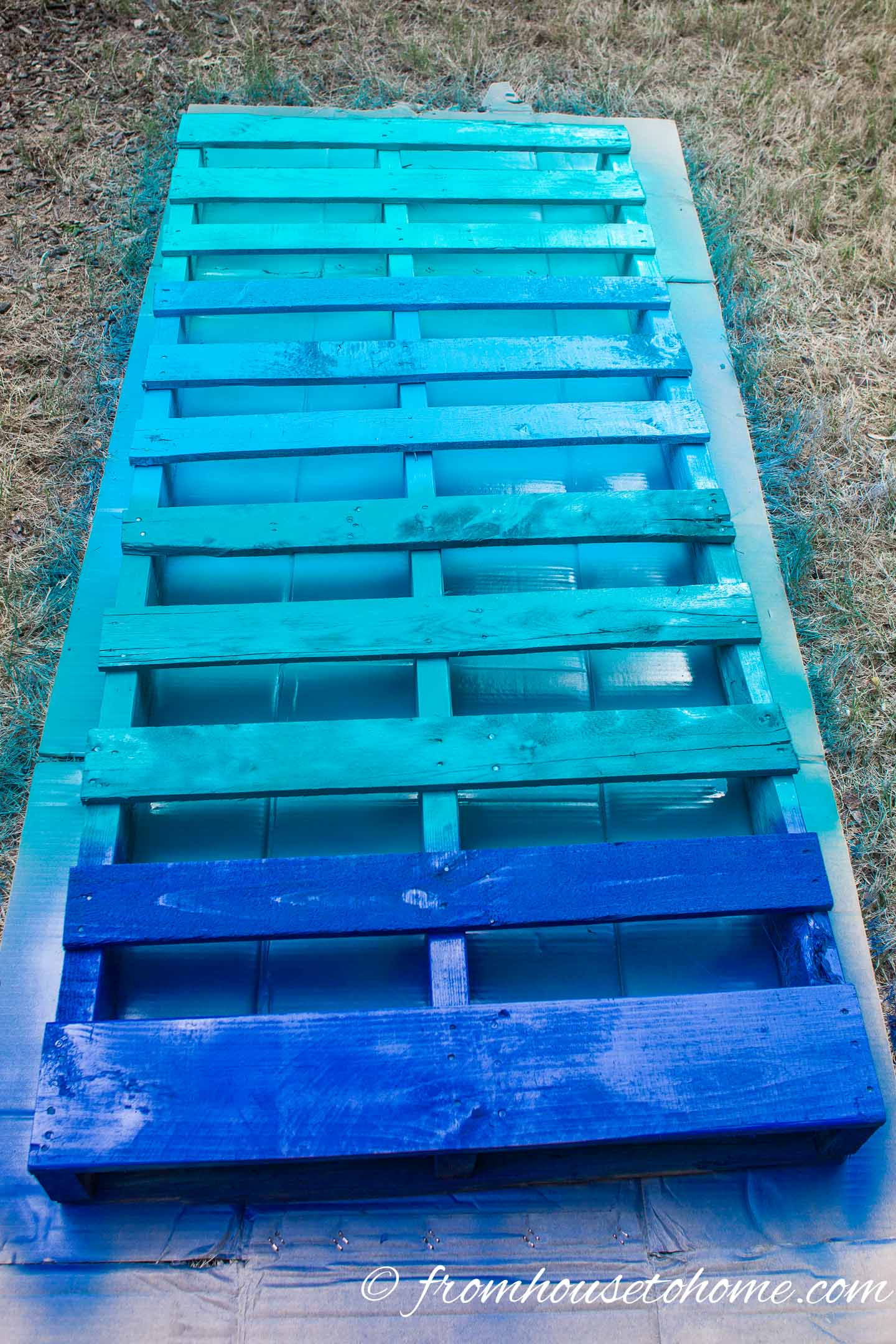 Pallet painted in a blue ombre pattern
