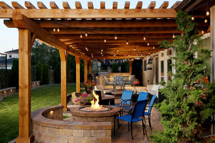 Pergola with string lights and a fire pit