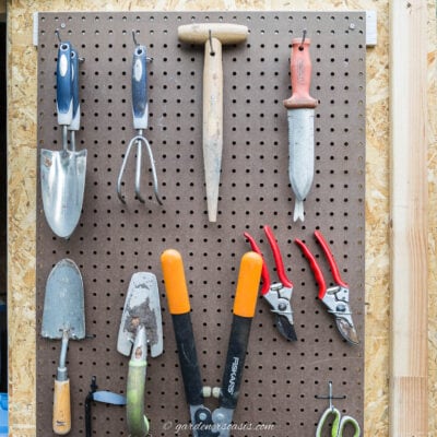 garden tools organized on pegboard
