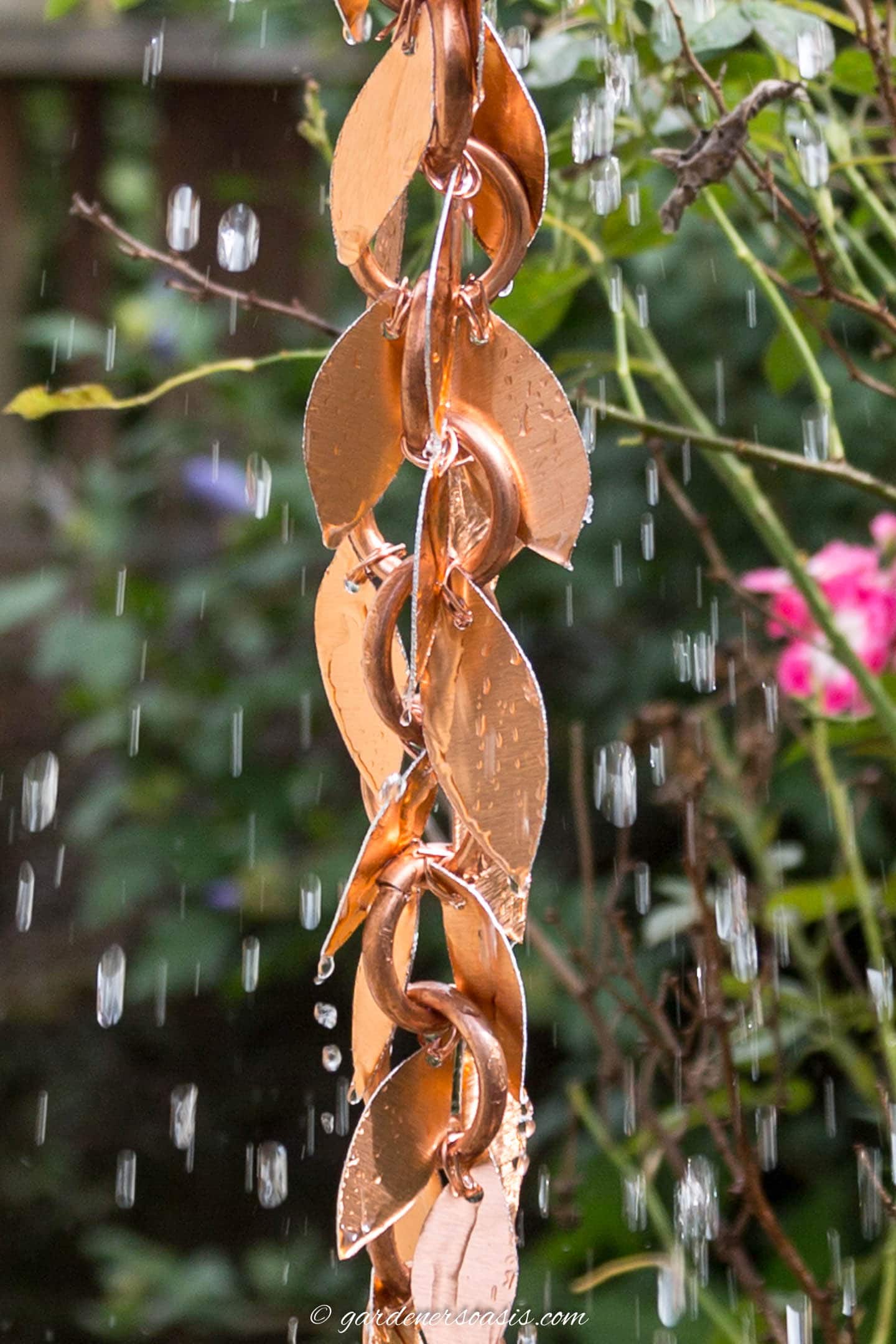DIY copper rain chain with leaves and water running down them