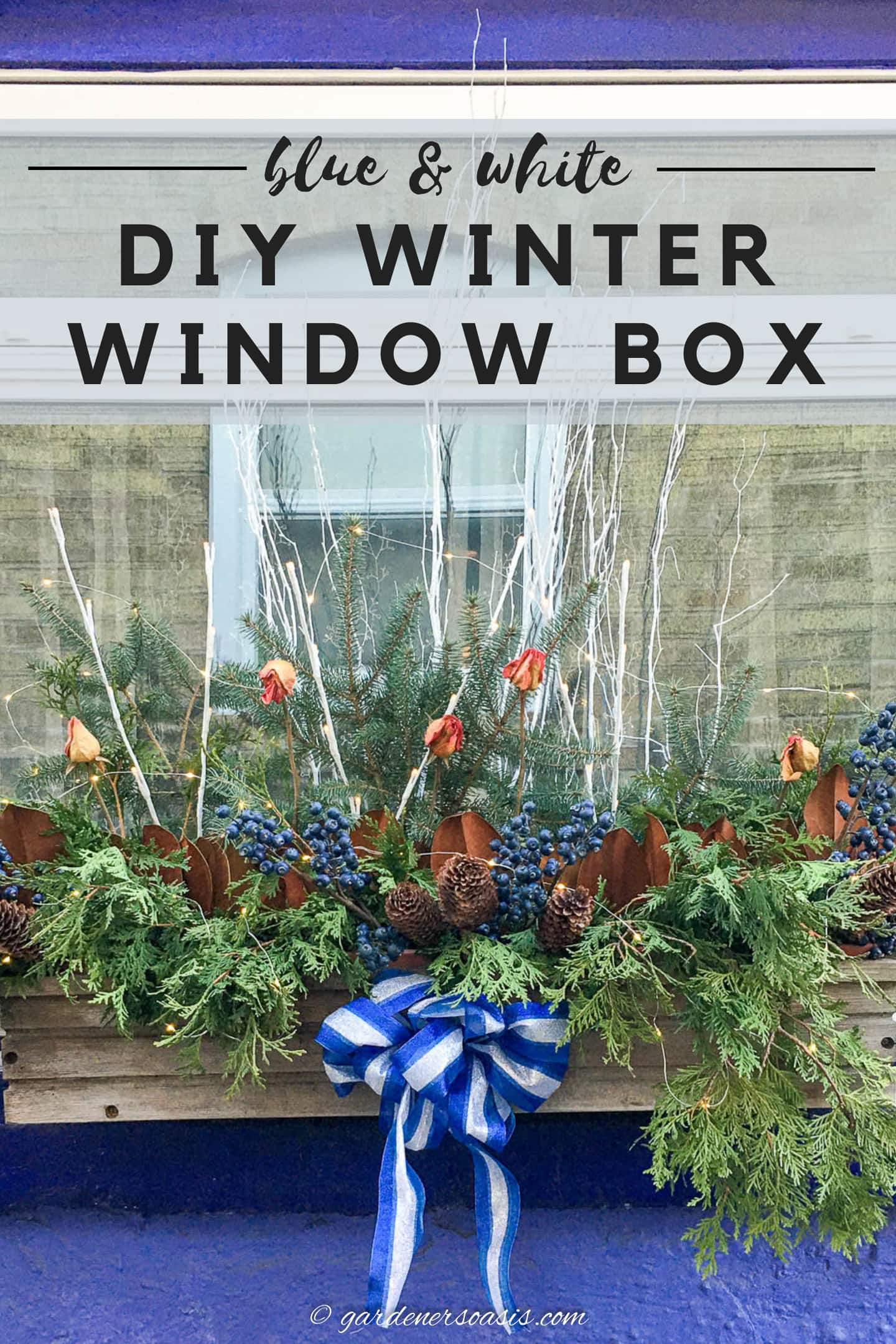 DIY winter window box with blue and white accents.