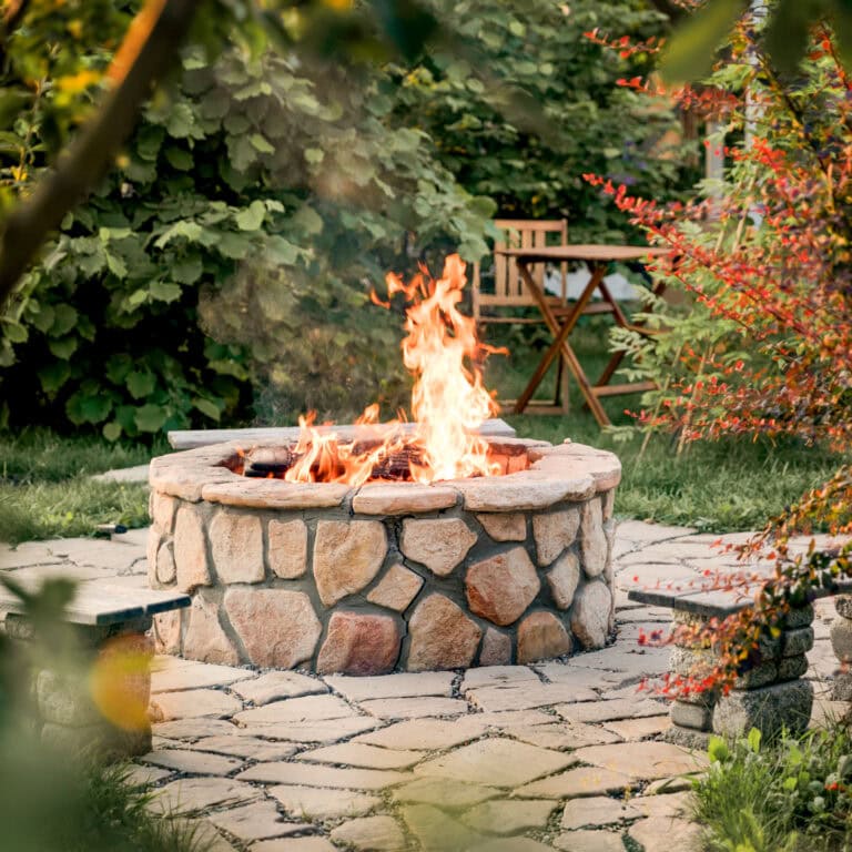 Patio and fire in the fire pit in the evening