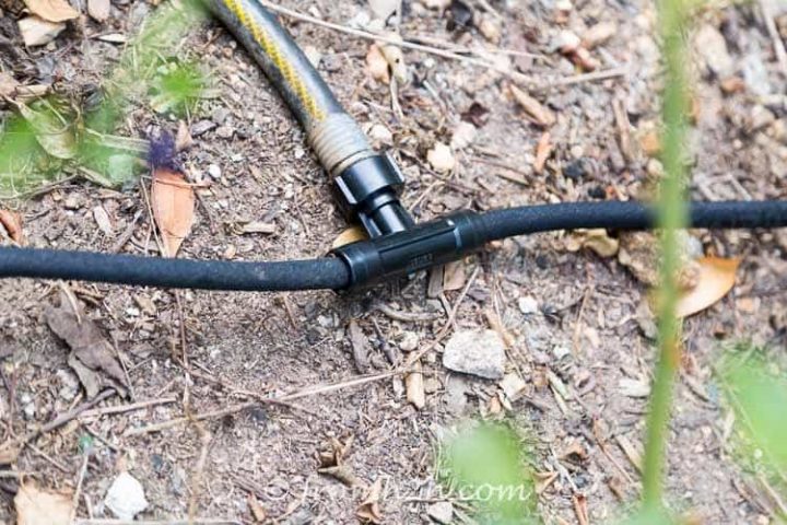 Use a splitter at the beginning of the run to send the water in 2 directions