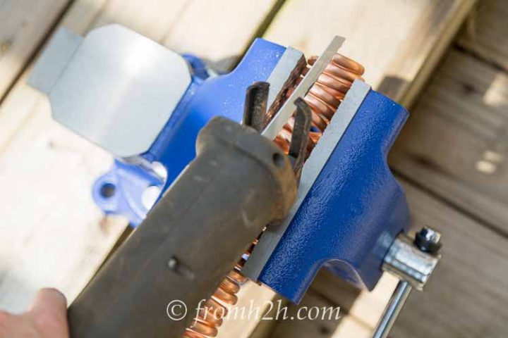 Cut the links using a reciprocating saw with a metal blade