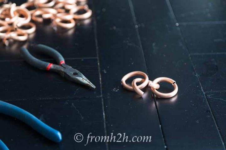 Use pliers to open a link wide enough for 2 other links to fit through