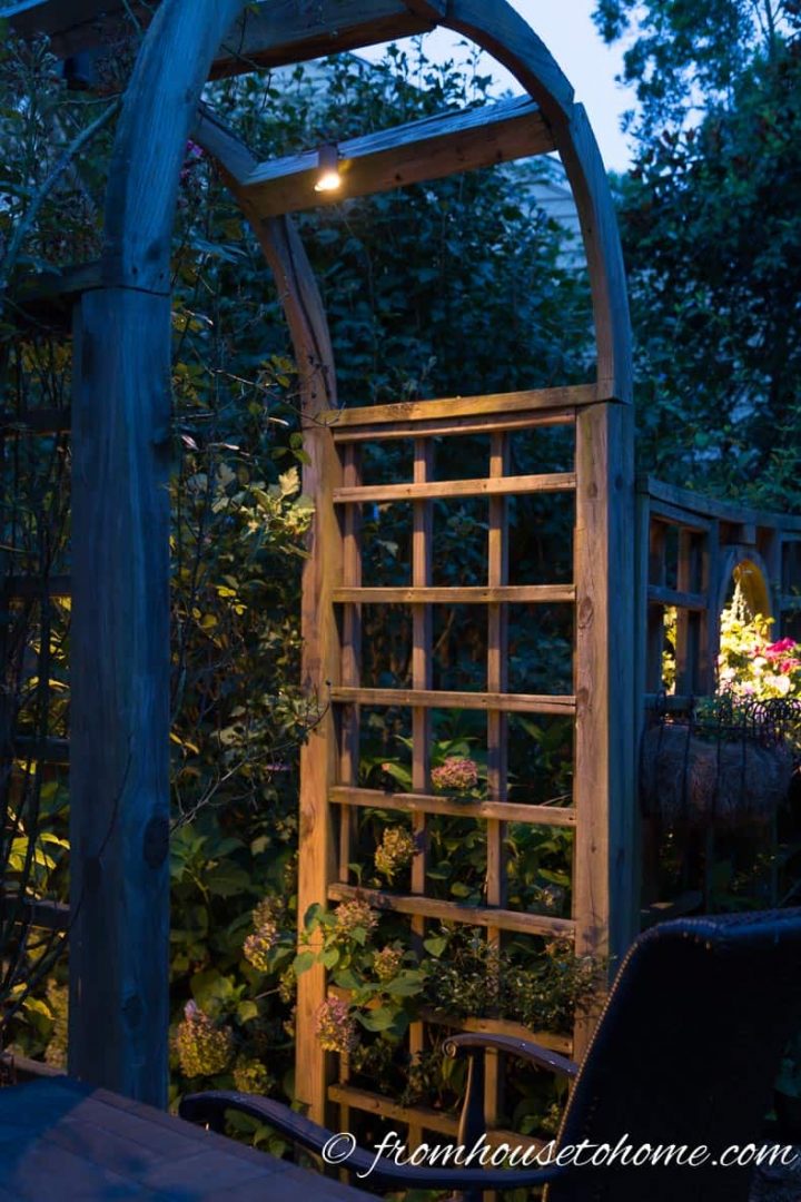 Install a downlight at the top of an arbor